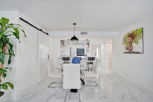 dining area with a barn door