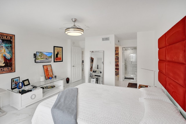 bedroom with ensuite bath and ceiling fan