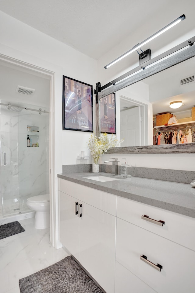 bathroom with vanity, toilet, and walk in shower