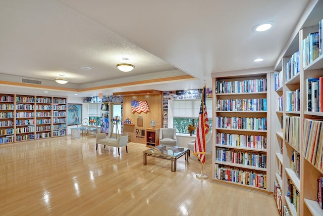 sitting room featuring hardwood / wood-style floors