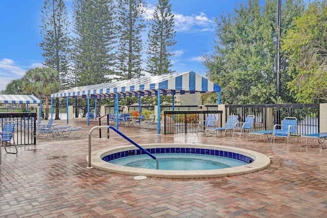 view of pool with a community hot tub and a patio area