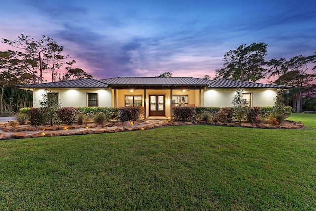 view of front of home with a lawn