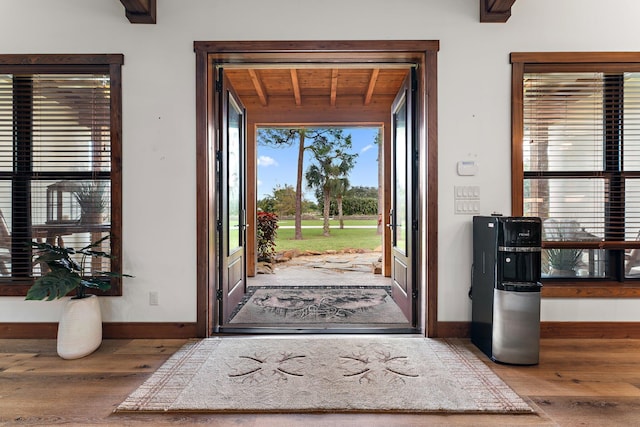 entrance foyer with wood ceiling and wood-type flooring