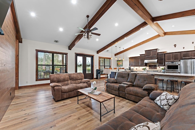 living room with french doors, ceiling fan, beam ceiling, high vaulted ceiling, and light hardwood / wood-style flooring