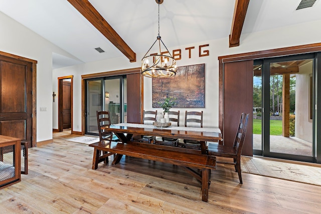 dining space featuring a chandelier, lofted ceiling with beams, and light hardwood / wood-style flooring