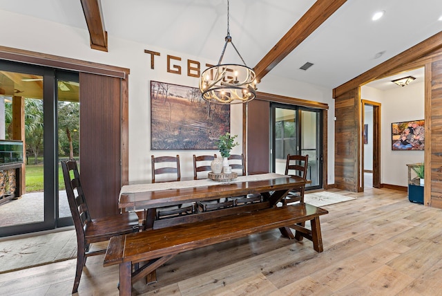 dining area featuring beamed ceiling, light hardwood / wood-style floors, french doors, and a chandelier