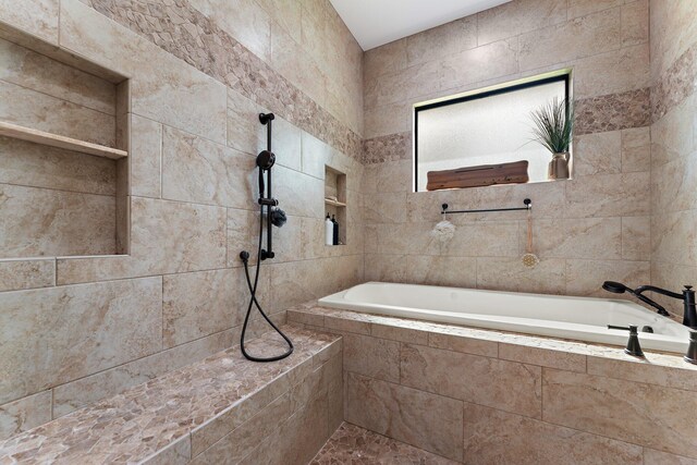 bathroom with vanity and a shower