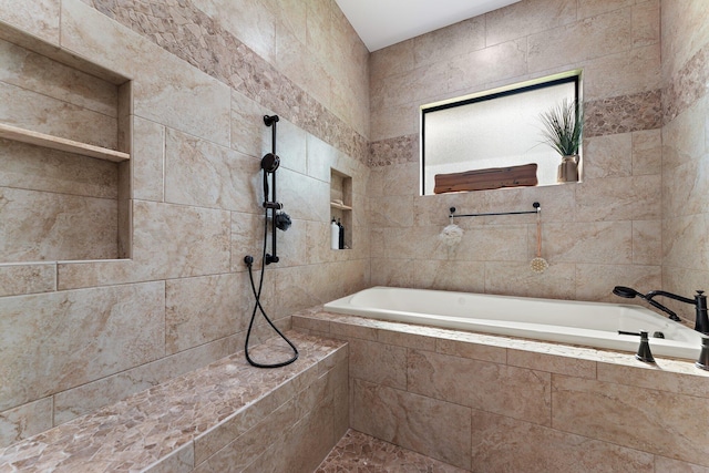 bathroom featuring a tile shower