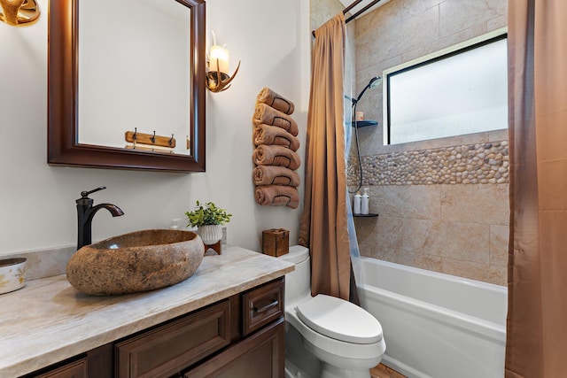 full bathroom featuring shower / bath combination with curtain, toilet, and vanity