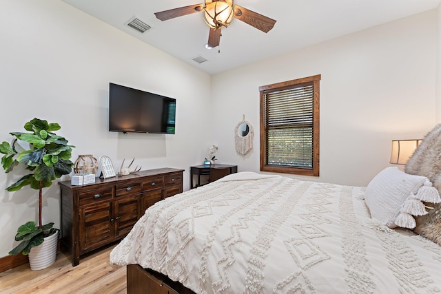 bedroom with light wood-type flooring and ceiling fan