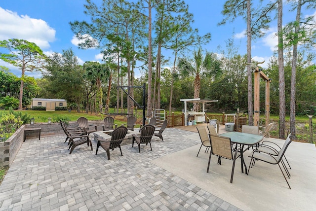 view of patio / terrace with an outdoor fire pit