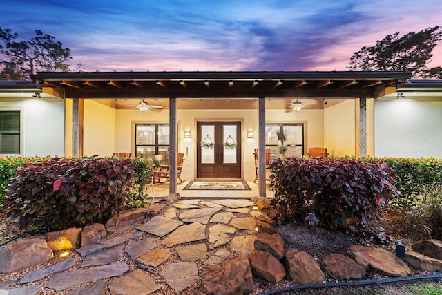 exterior entry at dusk with ceiling fan