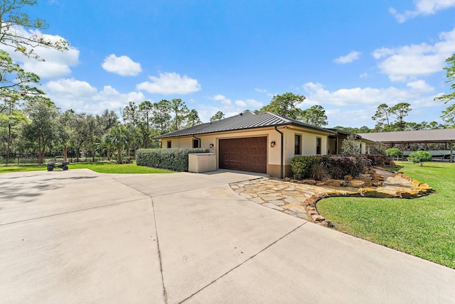 view of front facade featuring a front yard and a garage