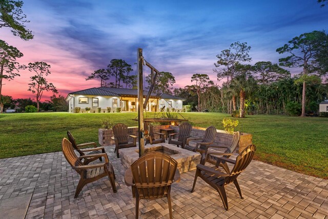 patio terrace at dusk with a fire pit