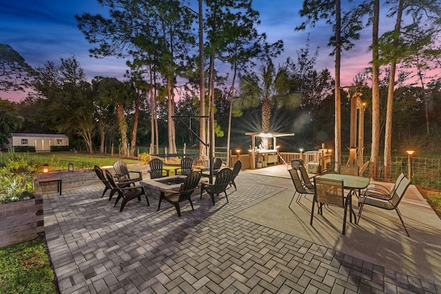 patio terrace at dusk with an outdoor fire pit