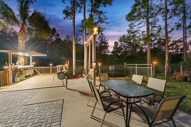 view of patio terrace at dusk