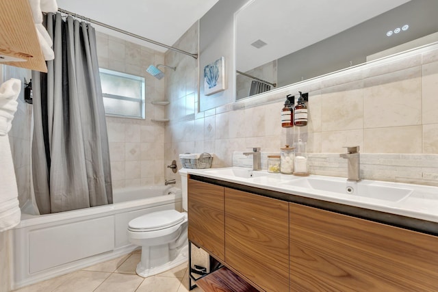 full bathroom featuring shower / bath combo, backsplash, vanity, tile walls, and tile patterned flooring