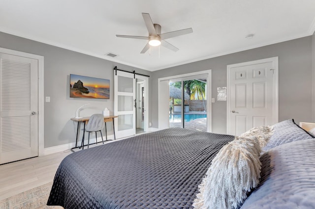 bedroom with light wood-type flooring, ornamental molding, access to outside, ceiling fan, and a barn door