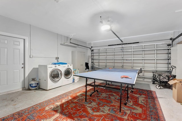 recreation room with concrete floors and independent washer and dryer