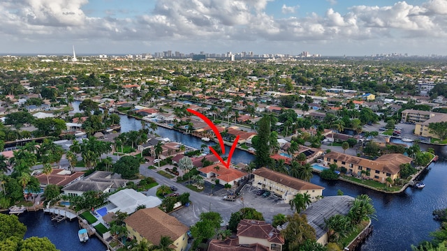 birds eye view of property featuring a water view