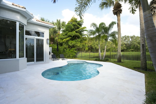 view of swimming pool featuring a patio