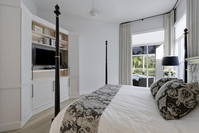 bedroom featuring access to exterior and light hardwood / wood-style floors