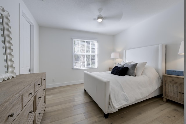 bedroom featuring ceiling fan and light wood-type flooring