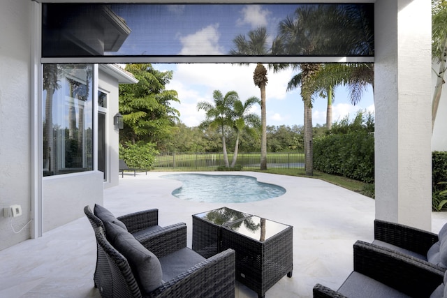 view of swimming pool with a water view and a patio