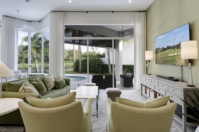 sunroom / solarium with ceiling fan