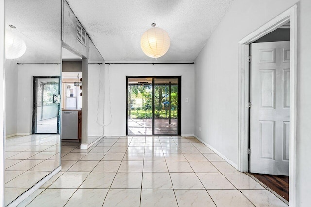 interior space featuring a textured ceiling