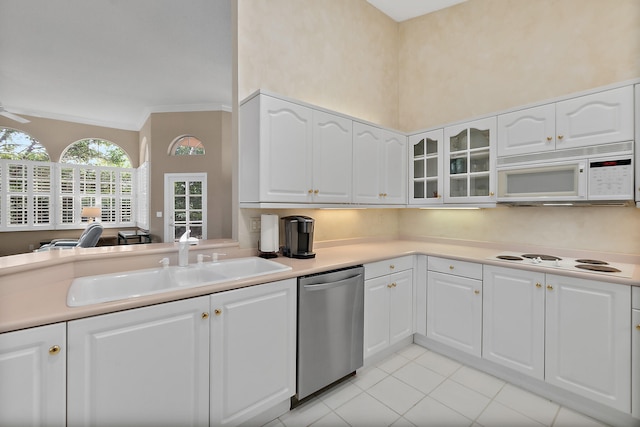 kitchen featuring white cabinets, sink, light tile patterned floors, ornamental molding, and white appliances