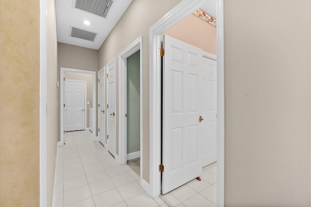 corridor featuring light tile patterned flooring