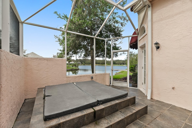 view of patio featuring a water view