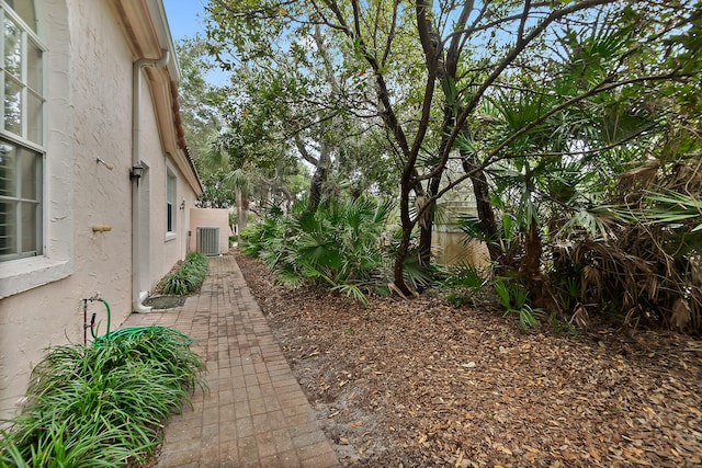 view of yard featuring central AC unit