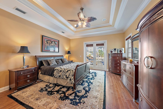 bedroom with access to exterior, ceiling fan, crown molding, and light hardwood / wood-style floors