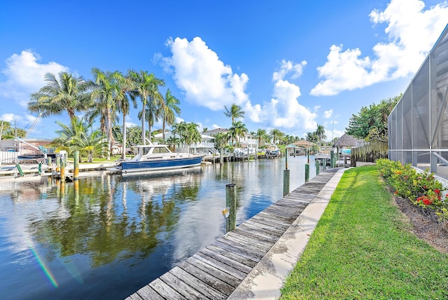 dock area with a water view and glass enclosure