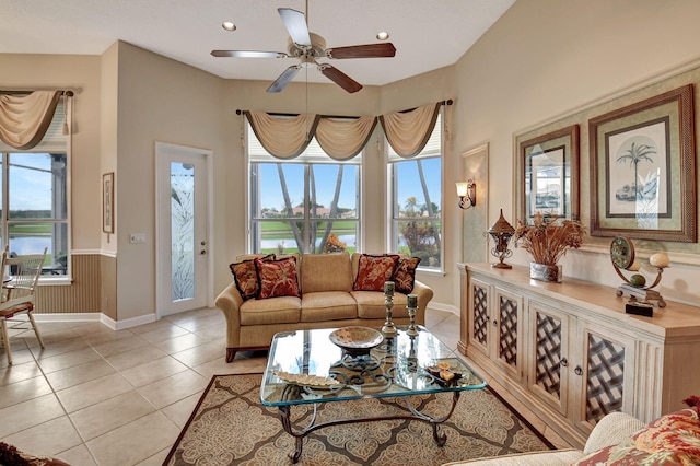 tiled living room with ceiling fan