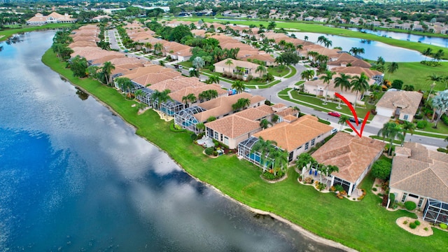 drone / aerial view with a water view