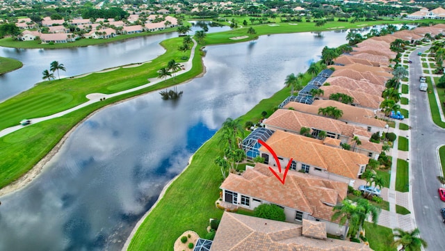 birds eye view of property with a water view