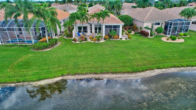 birds eye view of property with a water view