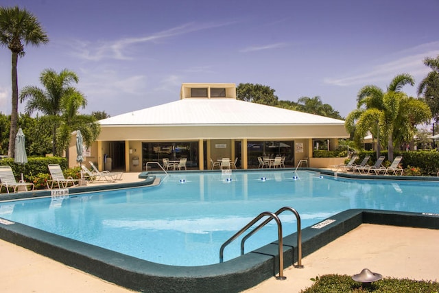 view of swimming pool with a patio area