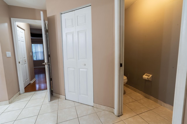 bathroom featuring tile patterned floors and toilet