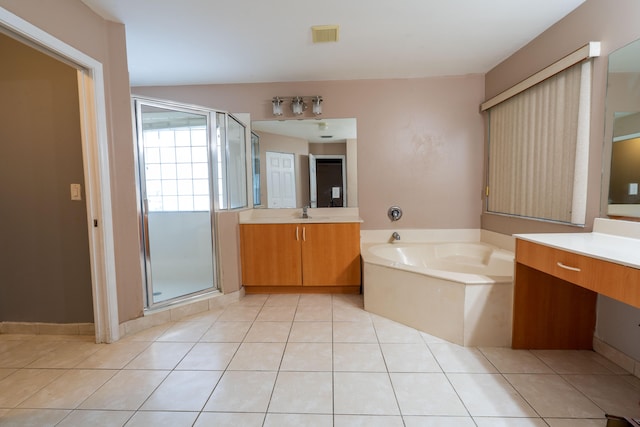 bathroom with tile patterned flooring, vanity, and independent shower and bath