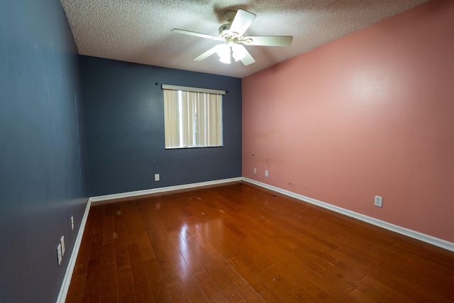 unfurnished room with ceiling fan, a textured ceiling, and hardwood / wood-style flooring