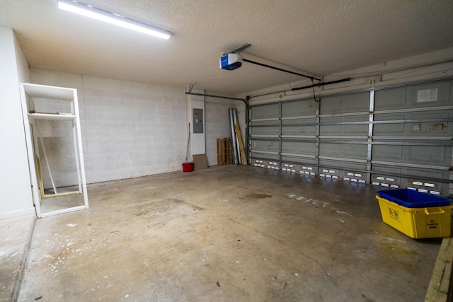 garage featuring electric panel and a garage door opener