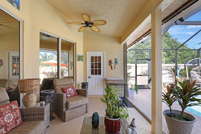 sunroom with a wealth of natural light and lofted ceiling