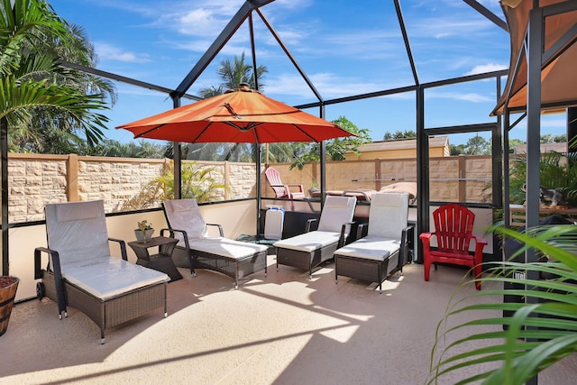 view of patio with glass enclosure