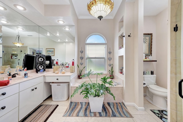 bathroom with tile patterned flooring, vanity, toilet, and crown molding