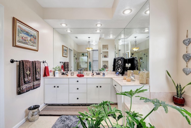 bathroom featuring tile patterned floors, vanity, and an enclosed shower