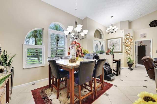 tiled dining space with french doors, a high ceiling, a textured ceiling, and a notable chandelier